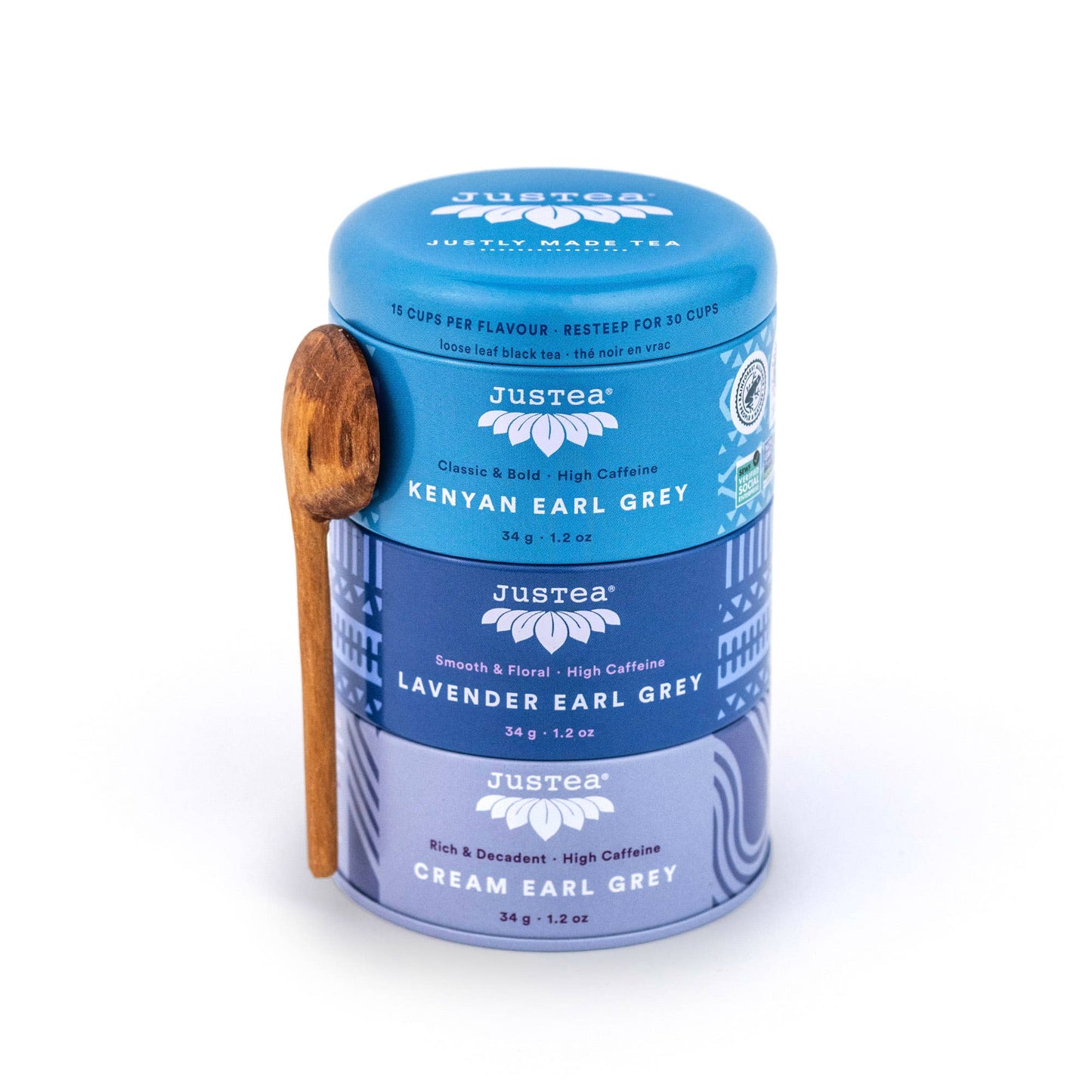 Just Tea tin with wooden spoon on a white background