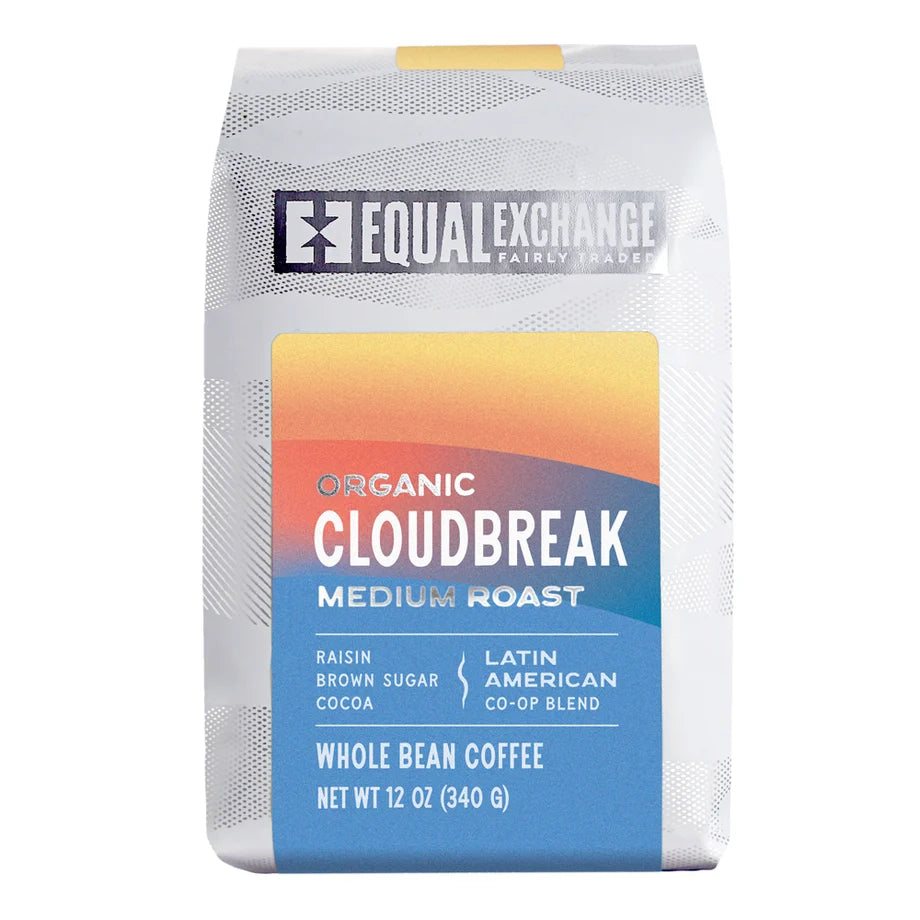 Equal Exchange Organic Cloudbreak Medium roast coffee whole bean front packaging. White Packaging with Light blue, peach and orange decoration.