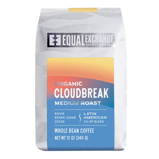 Equal Exchange Organic Cloudbreak Medium roast coffee whole bean front packaging. White Packaging with Light blue, peach and orange decoration.