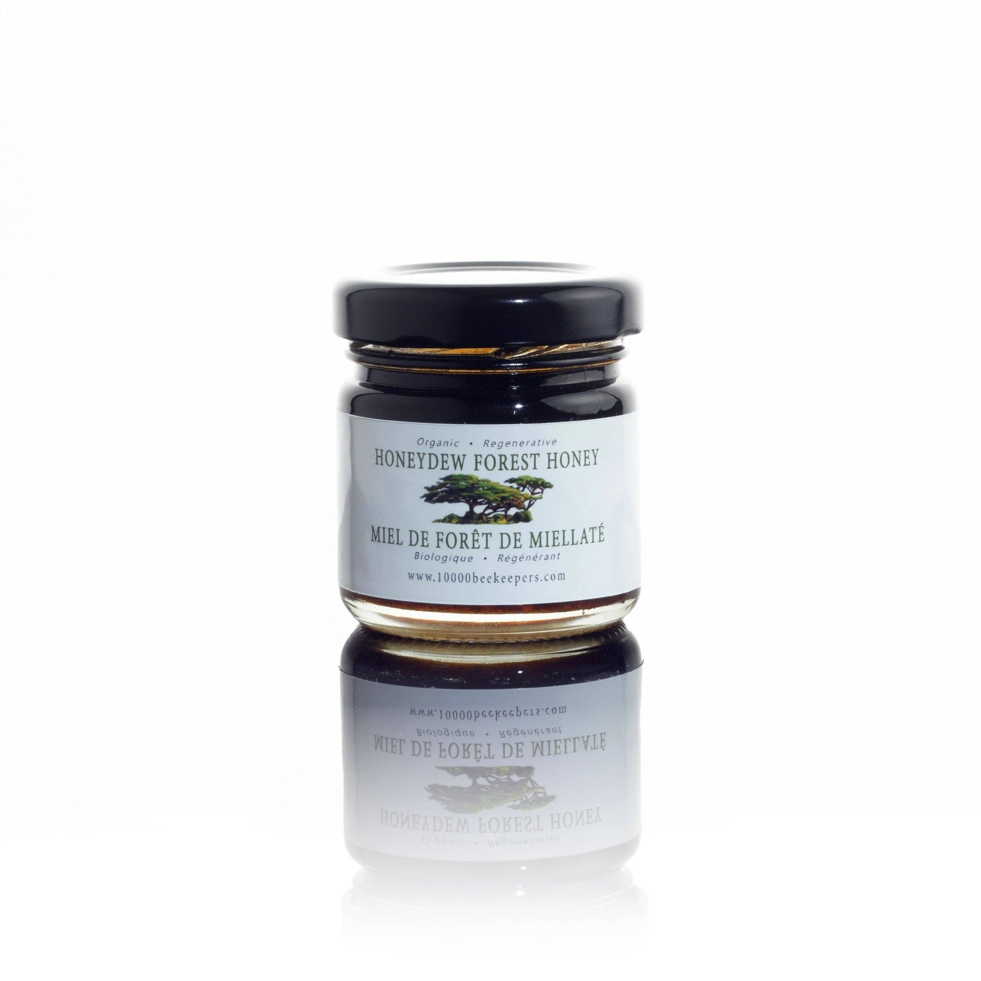 Jar of honey with a label on a white background