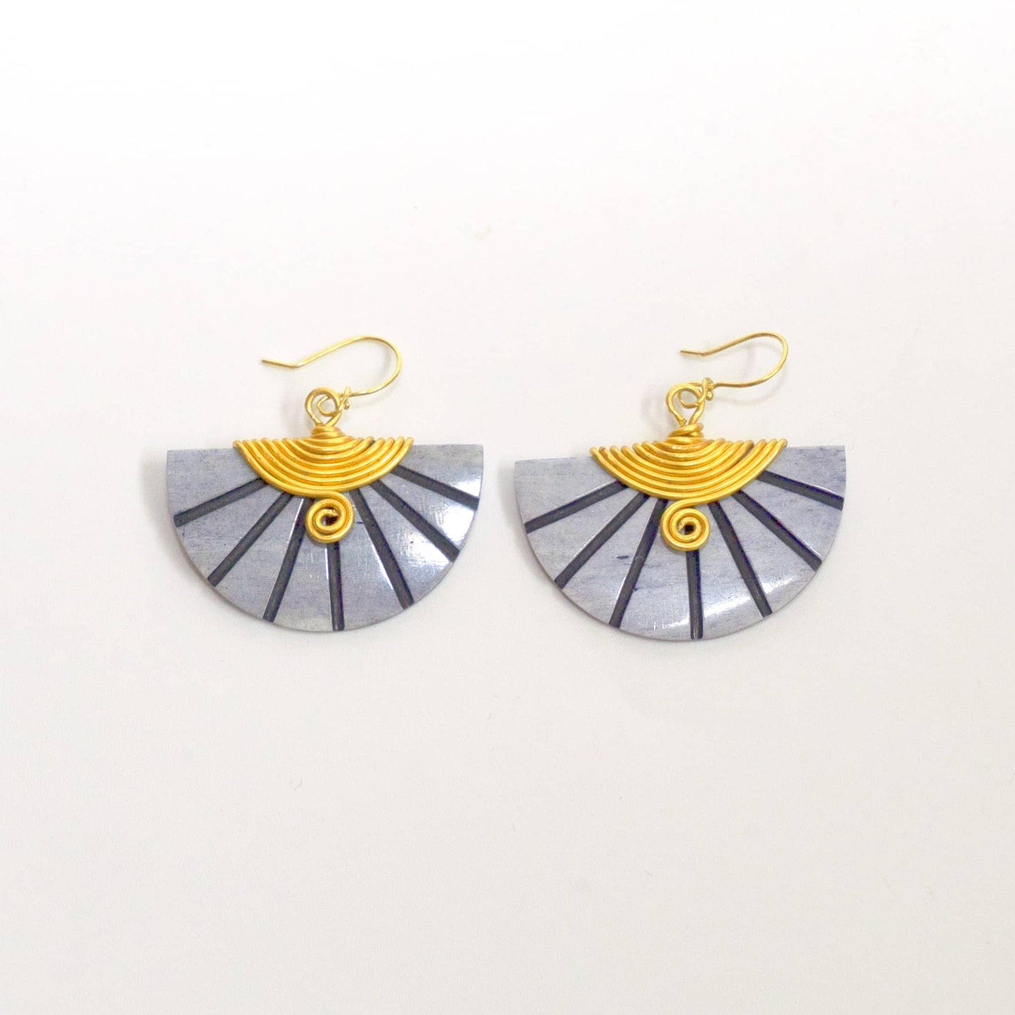 Pair of fan-shaped grey earrings with gold accents and French hooks on a white background