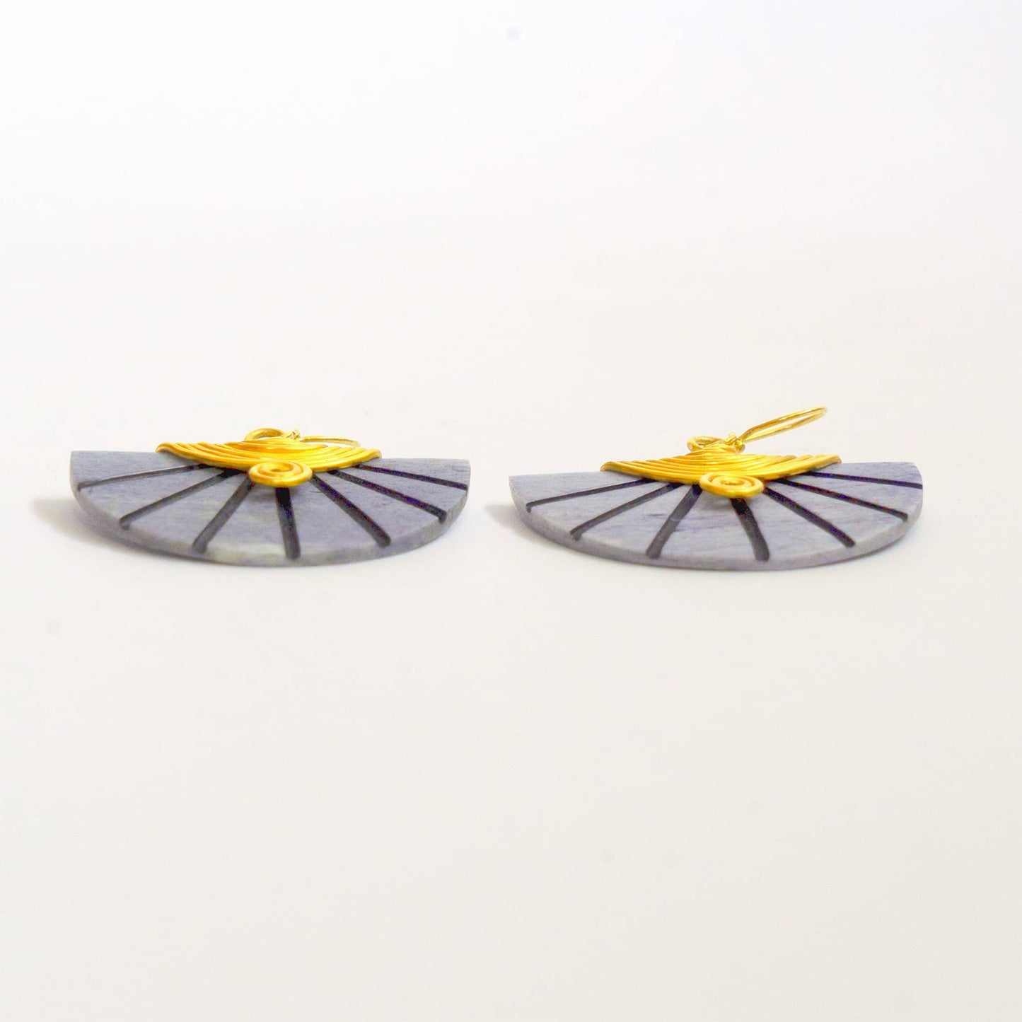 Pair of earrings shown from their bottom edge. Gray and yellow design on a white background