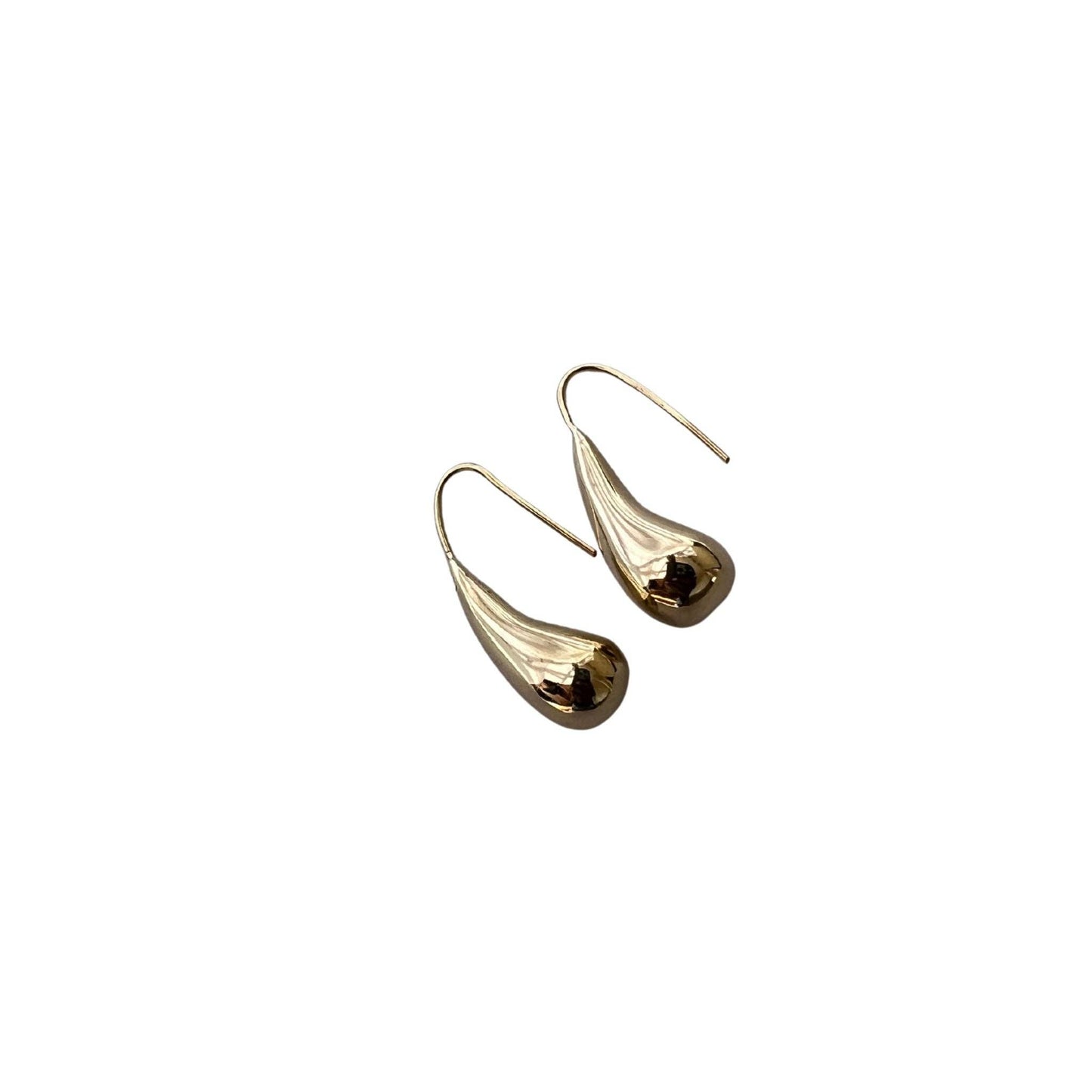 Gold teardrop earrings on a white background