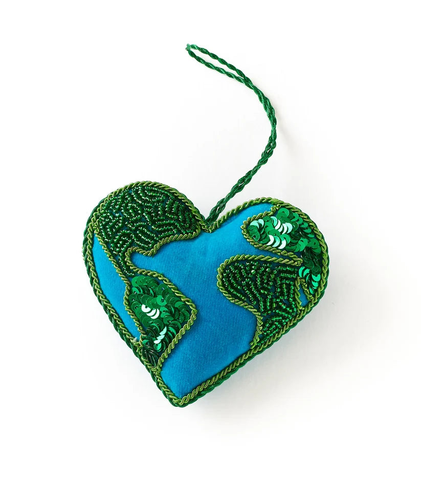 Heart-shaped Earth ornament featuring blue and green beadwork, colorful embroidered details and a hanging cord.