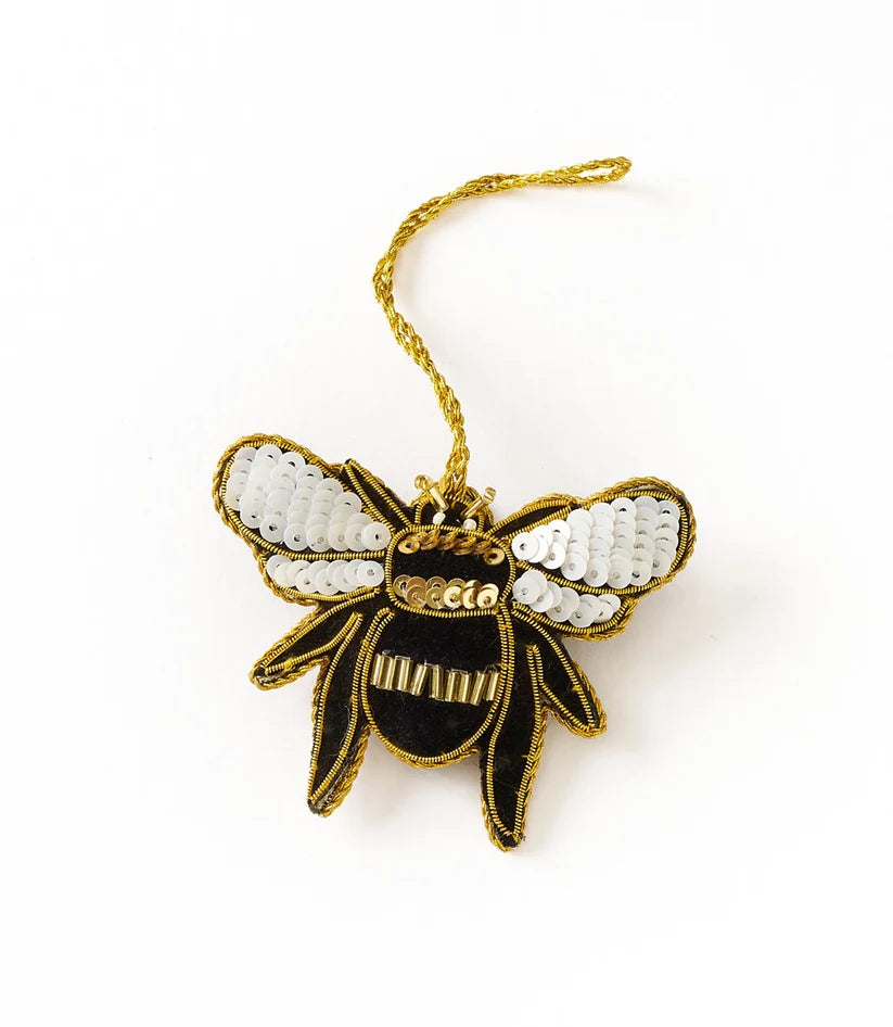 Colorful bee ornament featuring intricate beadwork, embroidered wings and a hanging cord.