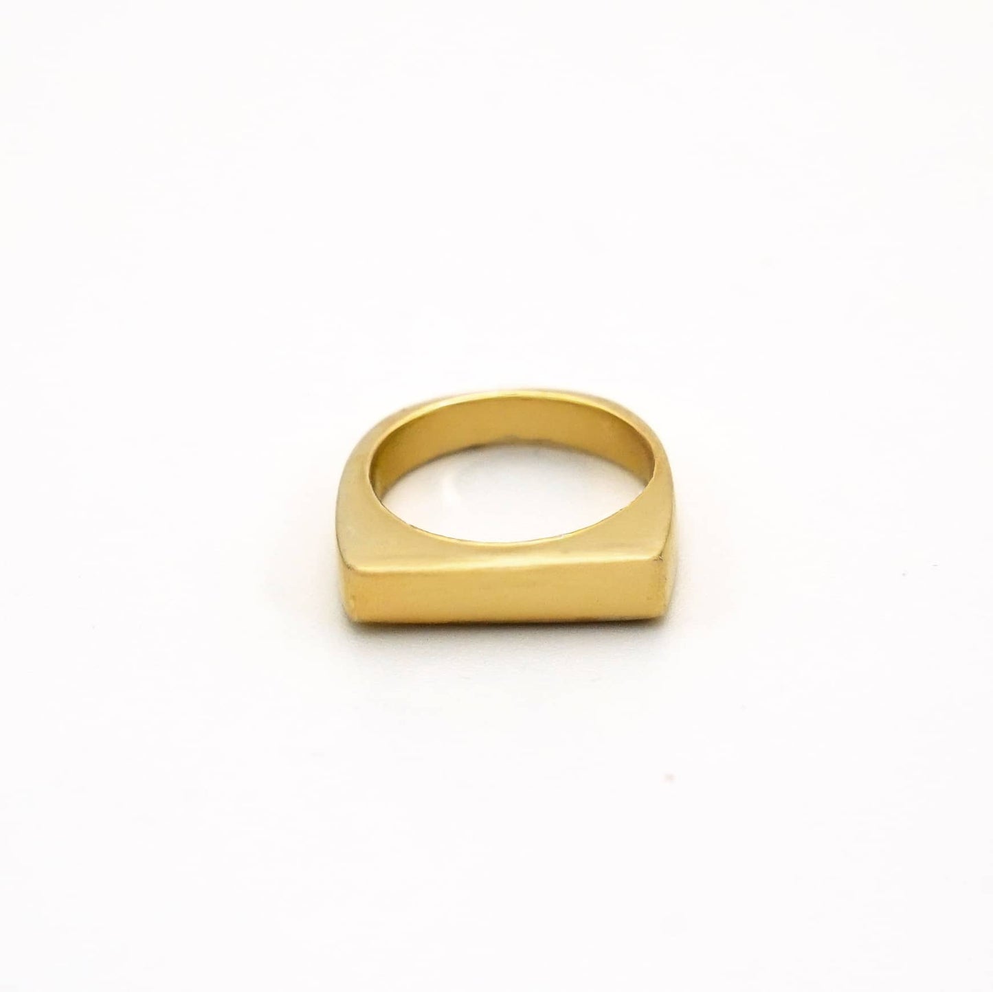 Gold ring on a white background