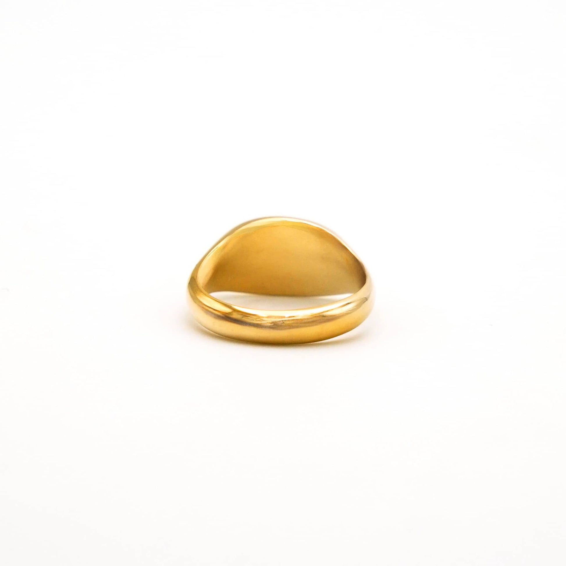 Gold ring on a white background