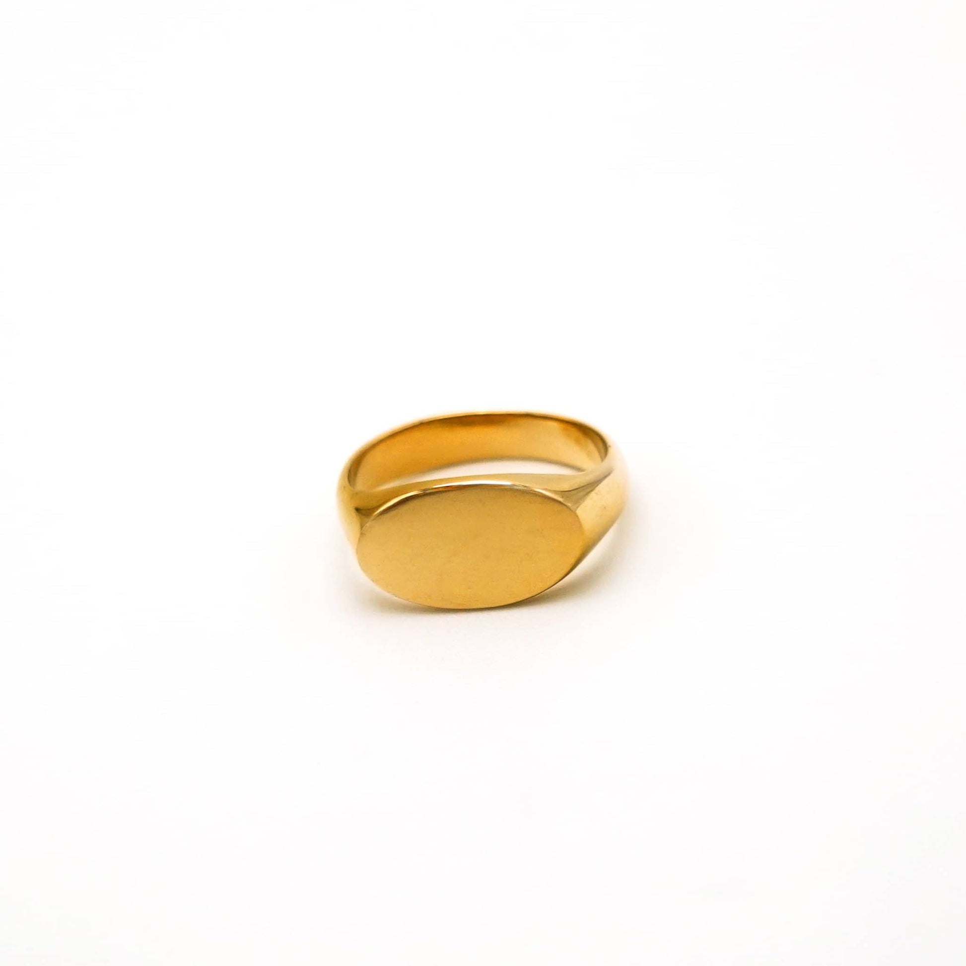 Gold ring on a white background