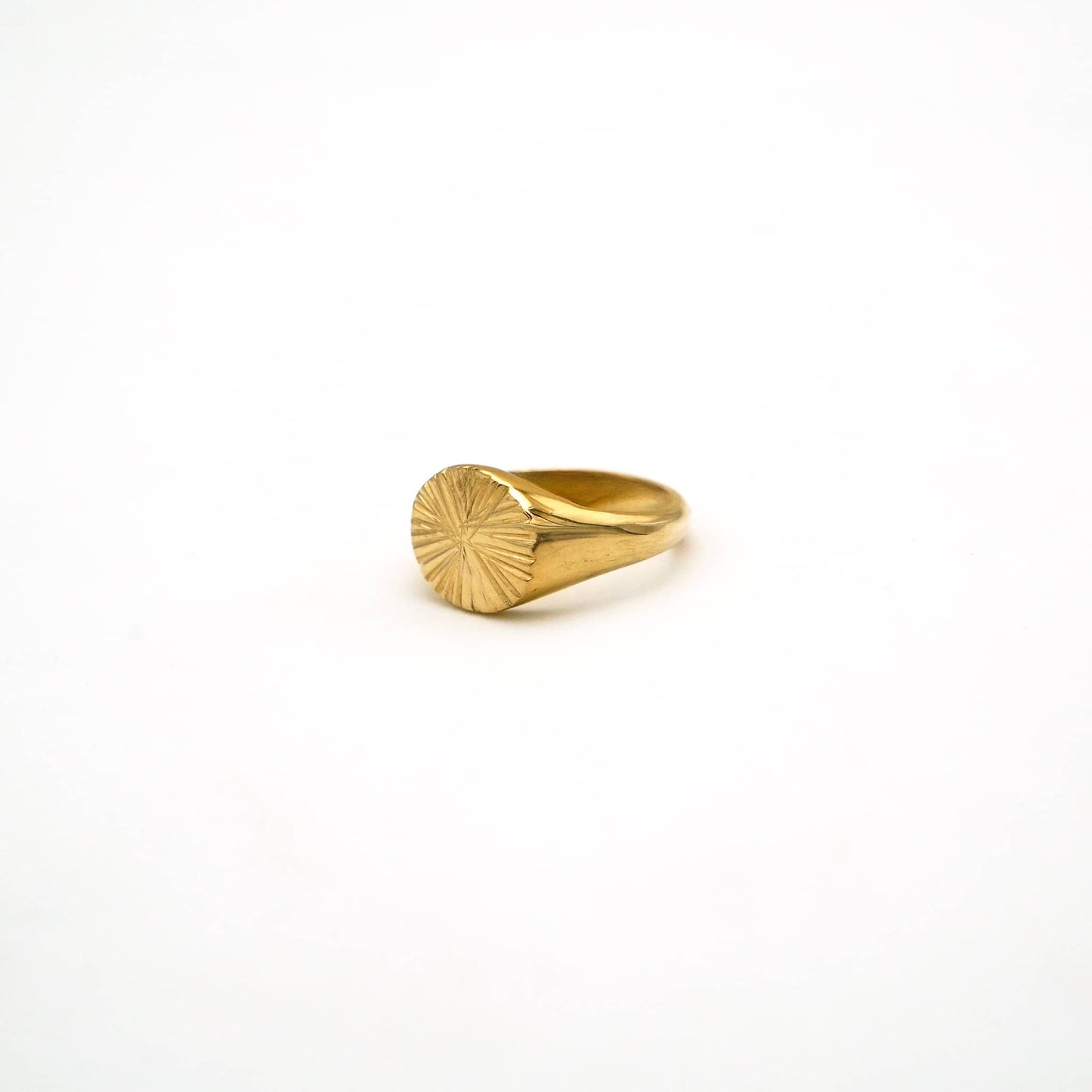 Gold ring on a white background