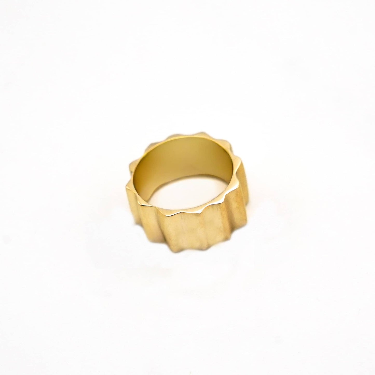 Gold ring on a white background