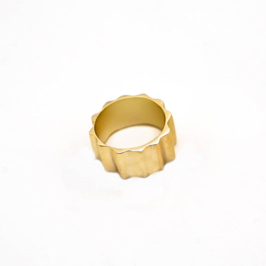 Gold ring on a white background