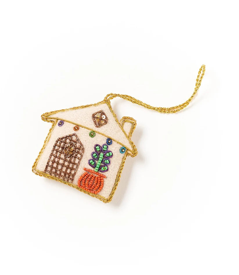 Colorful felt house ornament featuring intricate beadwork, embroidered details and metallic gold trim.