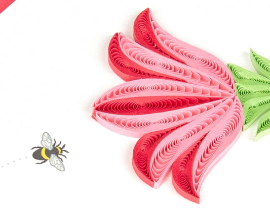 Pink and green paper quilling design on a white background with a bee icon.