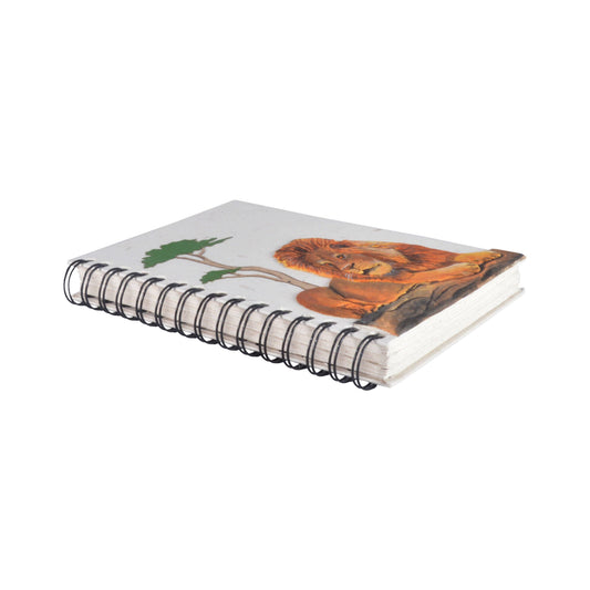 White notebook with a lion design on the cover and a black spiral binding on a white background
