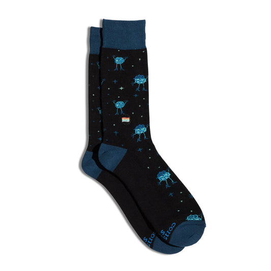 Black socks with blue disco balls wearing shoes and dancing on a white background