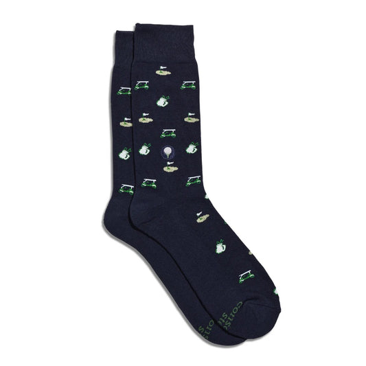 Navy pair of crew socks featuring small putting greens, golf bags, and golf carts in shades of green, gray, and tan.