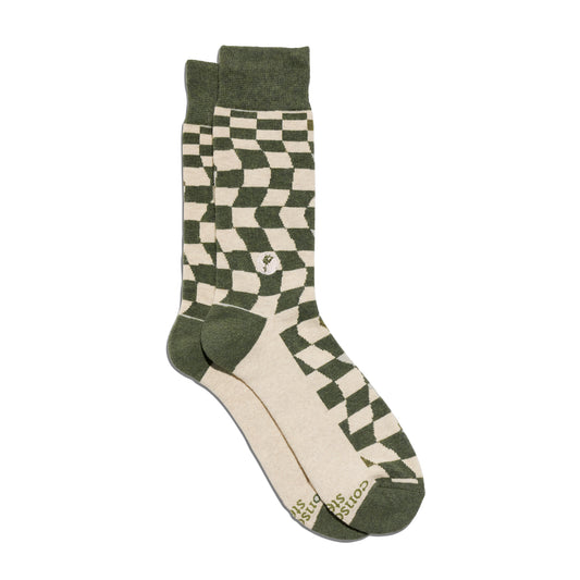 Green and beige checkered socks on a white background