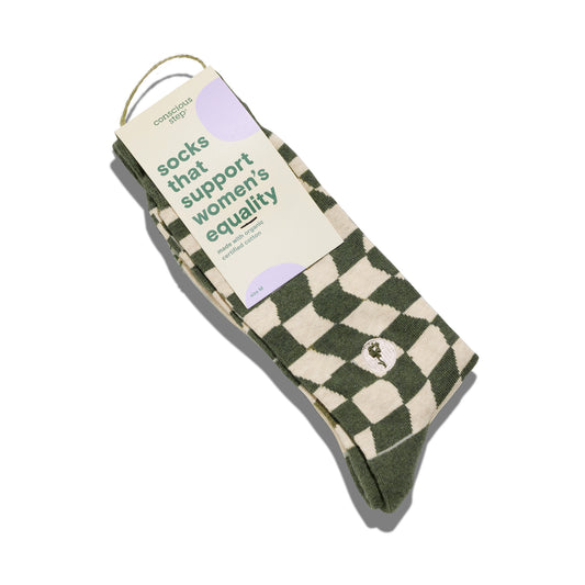 Green and beige checkered socks with a label on a white background