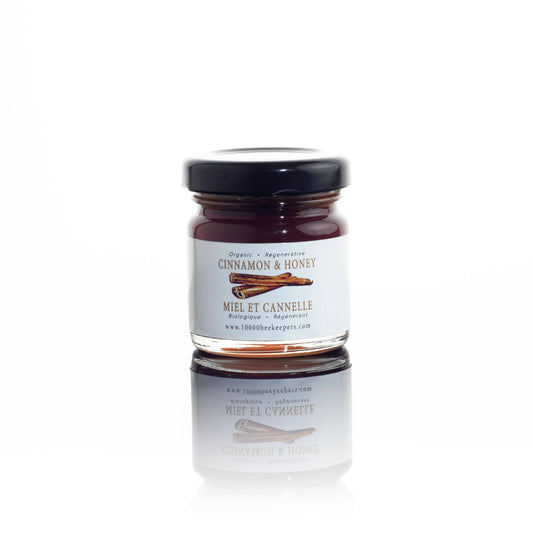 Jar of cinnamon honey on a white background
