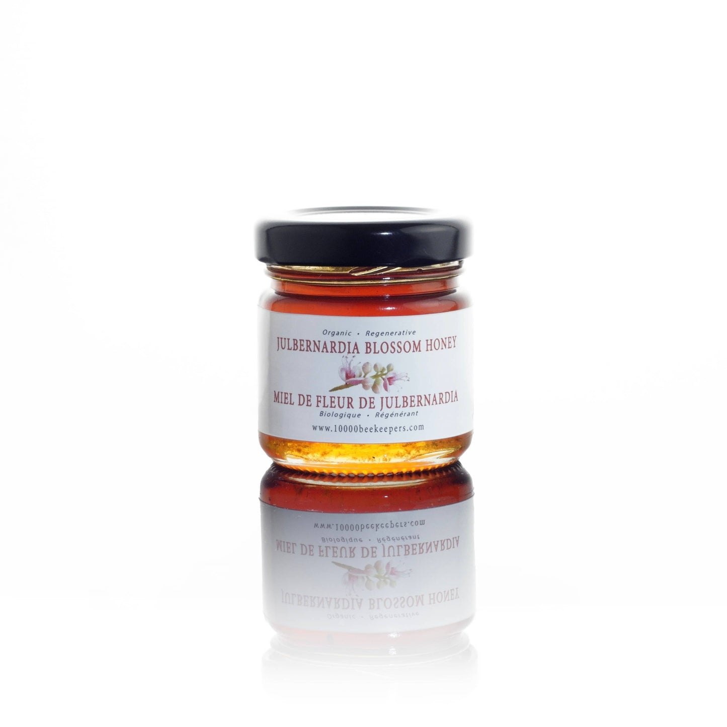 Jar of Julbernardia Blossom Honey on a white background