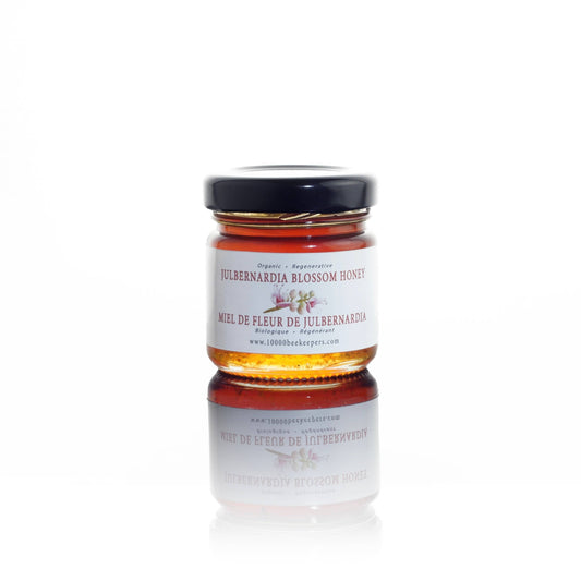 Jar of Julbernardia Blossom Honey on a white background