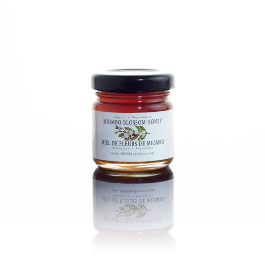 Jar of Miombo Blossom Honey on a white background
