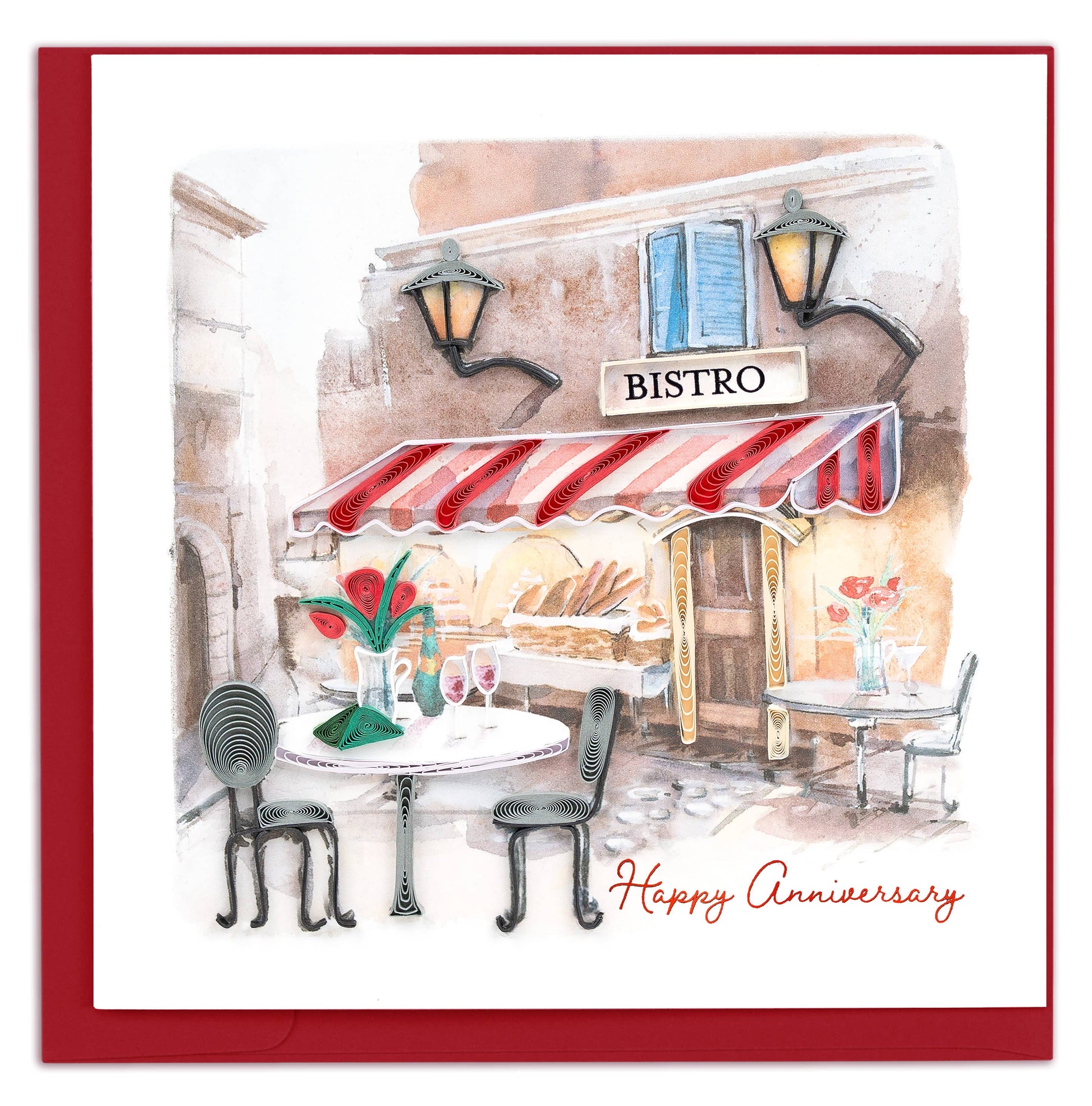 Quilled card featuring a bistro table set outside a Parisian-style cafe.