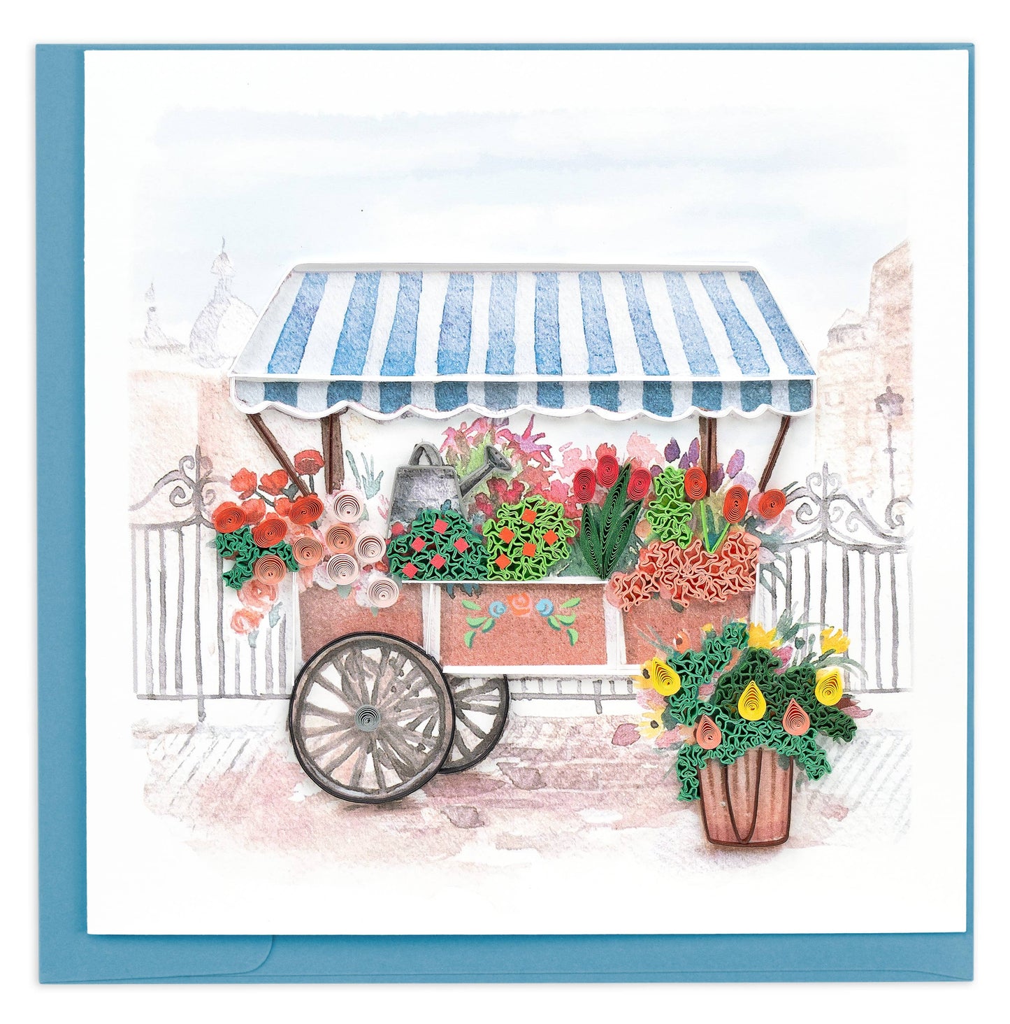 A push cart filled with quilled flowers is covered with a striped blue and white awning.