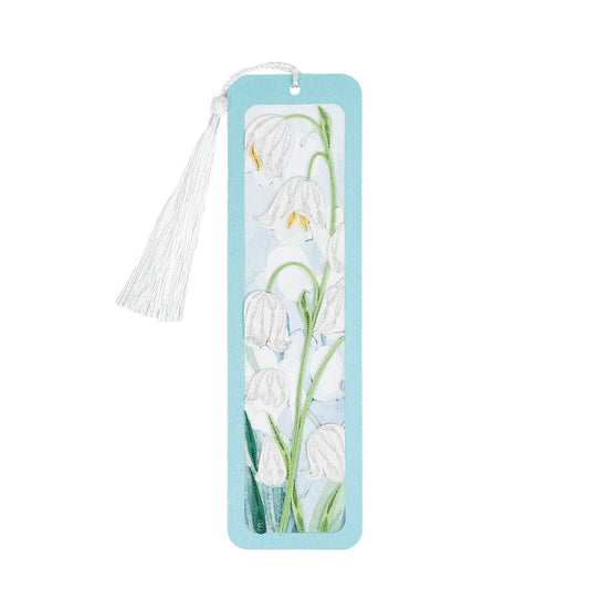 White flowers adorn this narrow light blue bookmark.