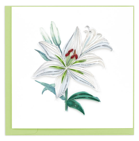 A large white lily with small green details and green leaves is created with quilled paper.