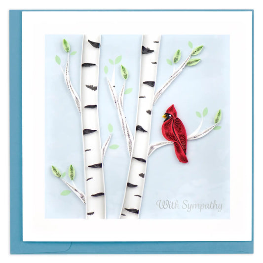 Card with red cardinal bird on a branch against a light blue background