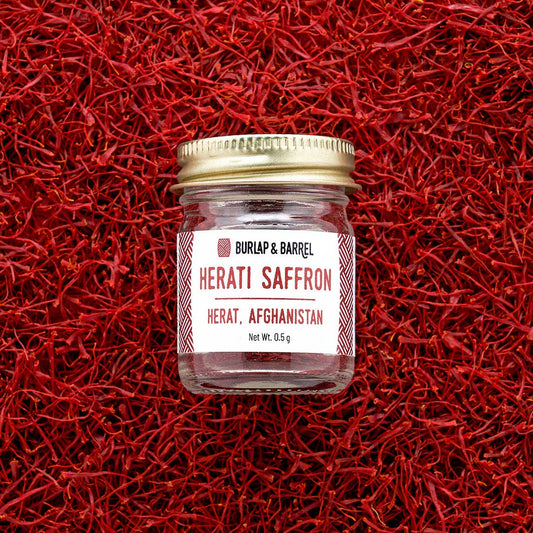 Jar of Herati Saffron on a red saffron background