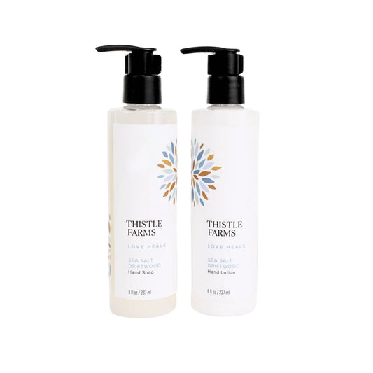 two clear bottles with black pumps on a white background