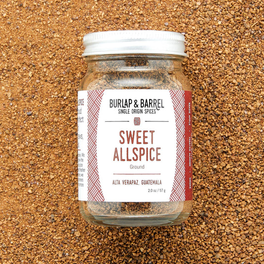 Jar of Burlap & Barrel Sweet Allspice on a textured brown surface