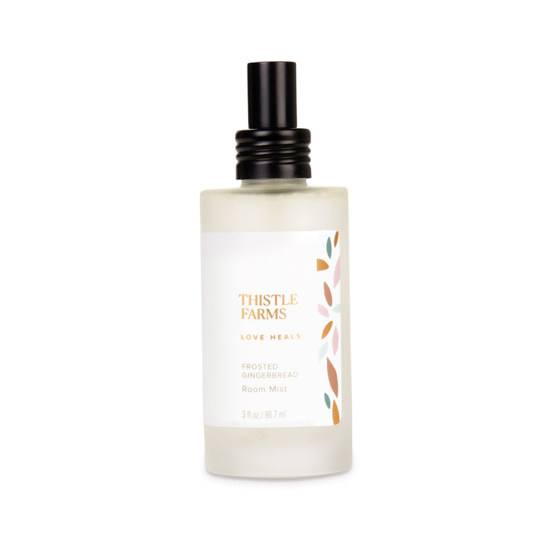 Frosted glass bottle with black lid on a white background