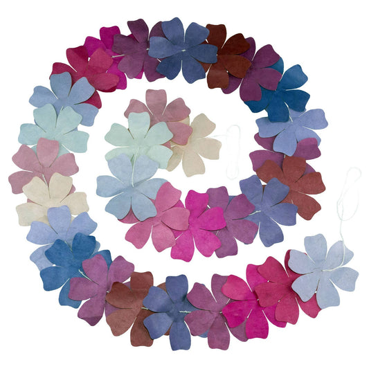 Floral garland with pink, blue, and purple flowers on a white background