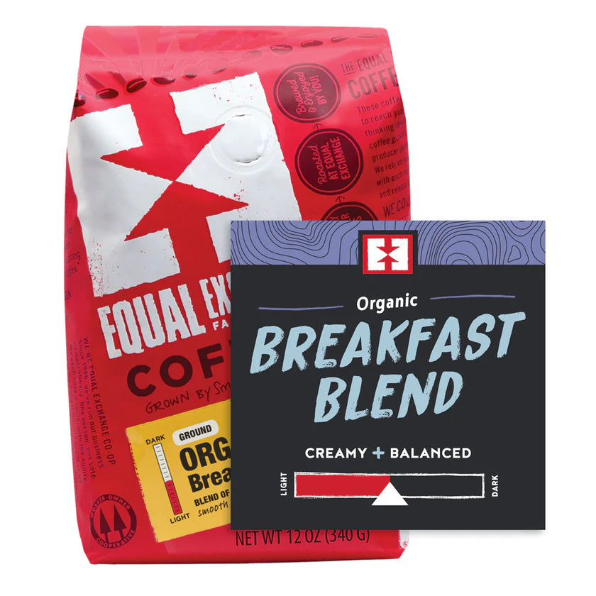 Two Equal Exchange Breakfast Blend coffee packages, one red and one black on a white background.