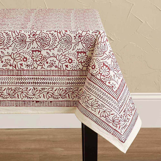 Cotton tablecloth with a hand-block-printed cranberry-red floral vine pattern.