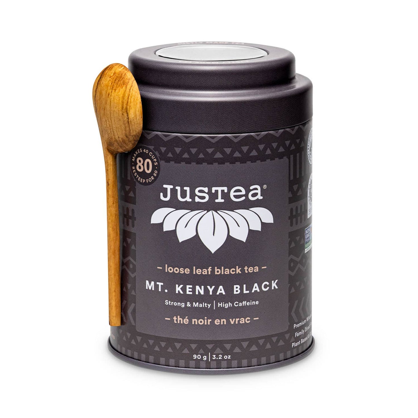 Justea Mt. Kenya Black tea canister with a wooden spoon on a white background