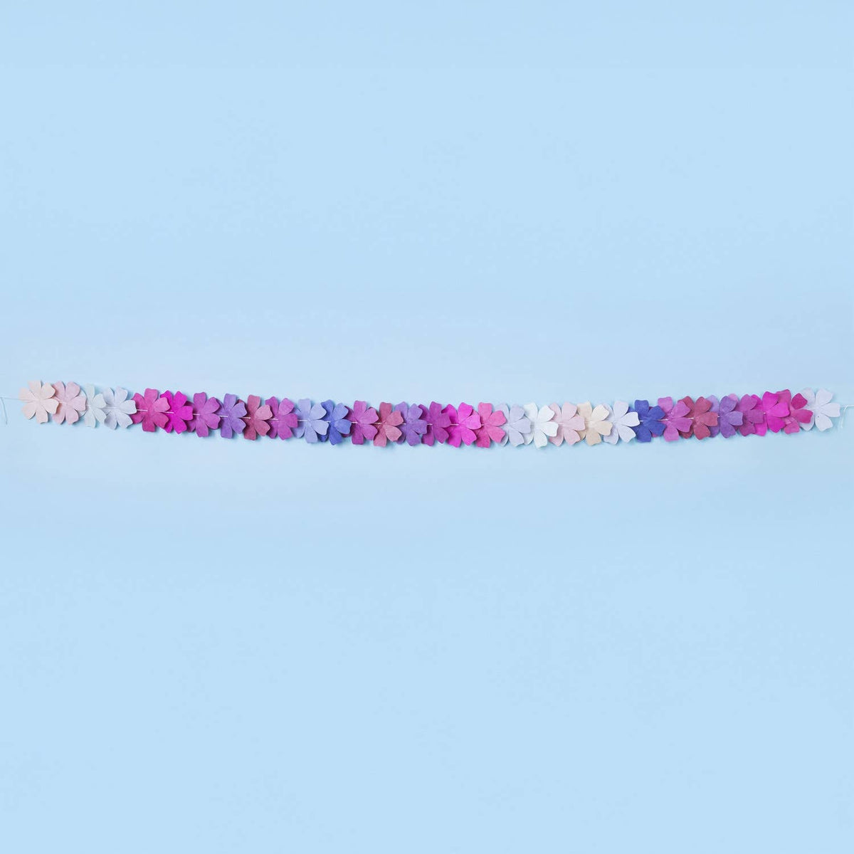 Decorative garland with colorful flowers on a light blue background