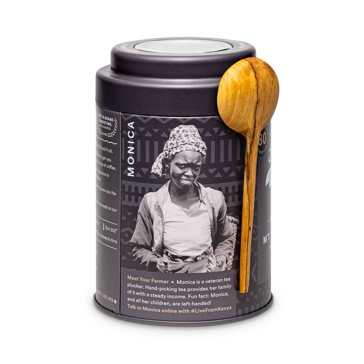 Tea canister with wooden spoon featuring a picture of Kenyan farmer partner, Monica.