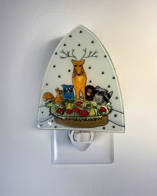 Decorative night light with animal illustrations on a white background
