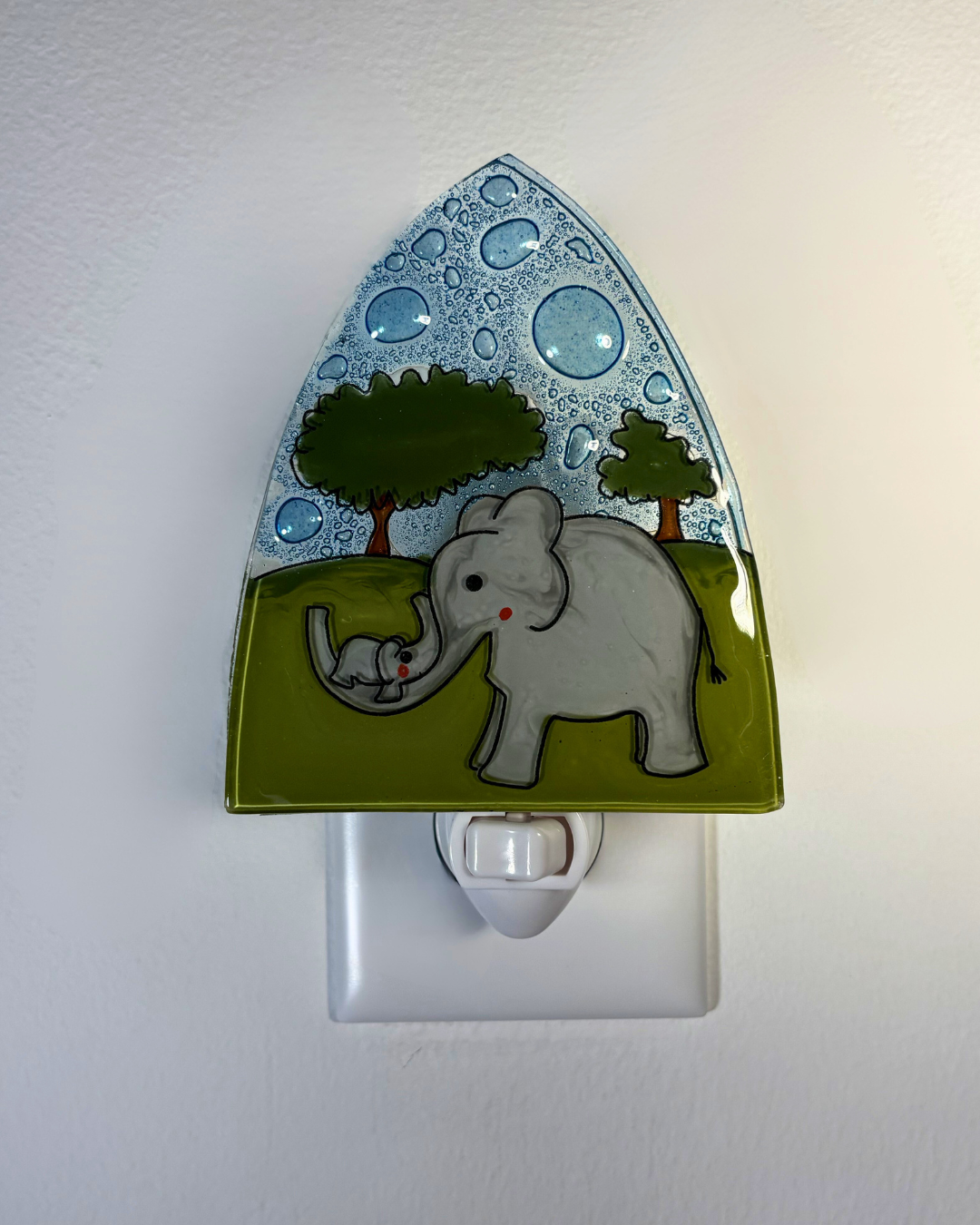 Night light with elephant and baby design on a white background