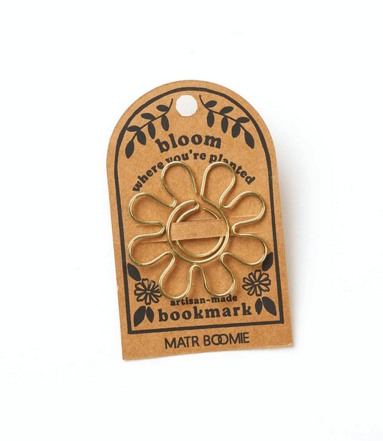 Gold wire daisy-shaped bookmark attached to cardstock with the words "bloom where you're planted"