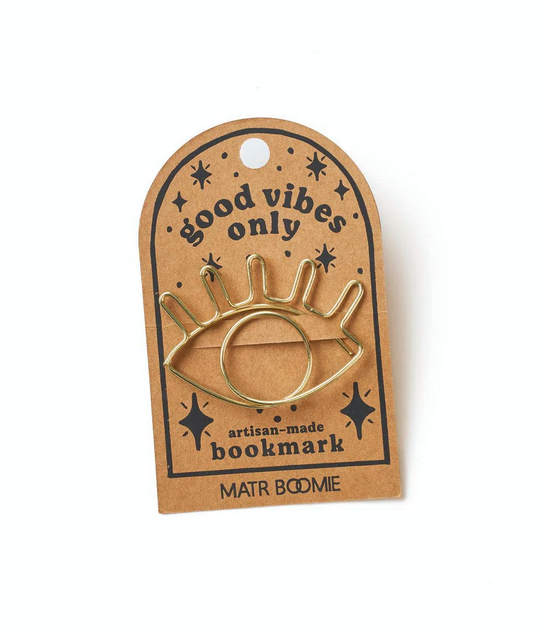 Gold wire evil eye-shaped bookmark attached to cardstock with the words "good vibes only"