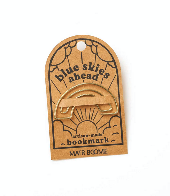Gold wire rainbow-shaped bookmark attached to cardstock with the words "blue skies ahead"