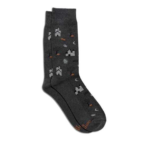 Dark grey socks with spooky houses, ghosts, moons, trees and pumpkins.