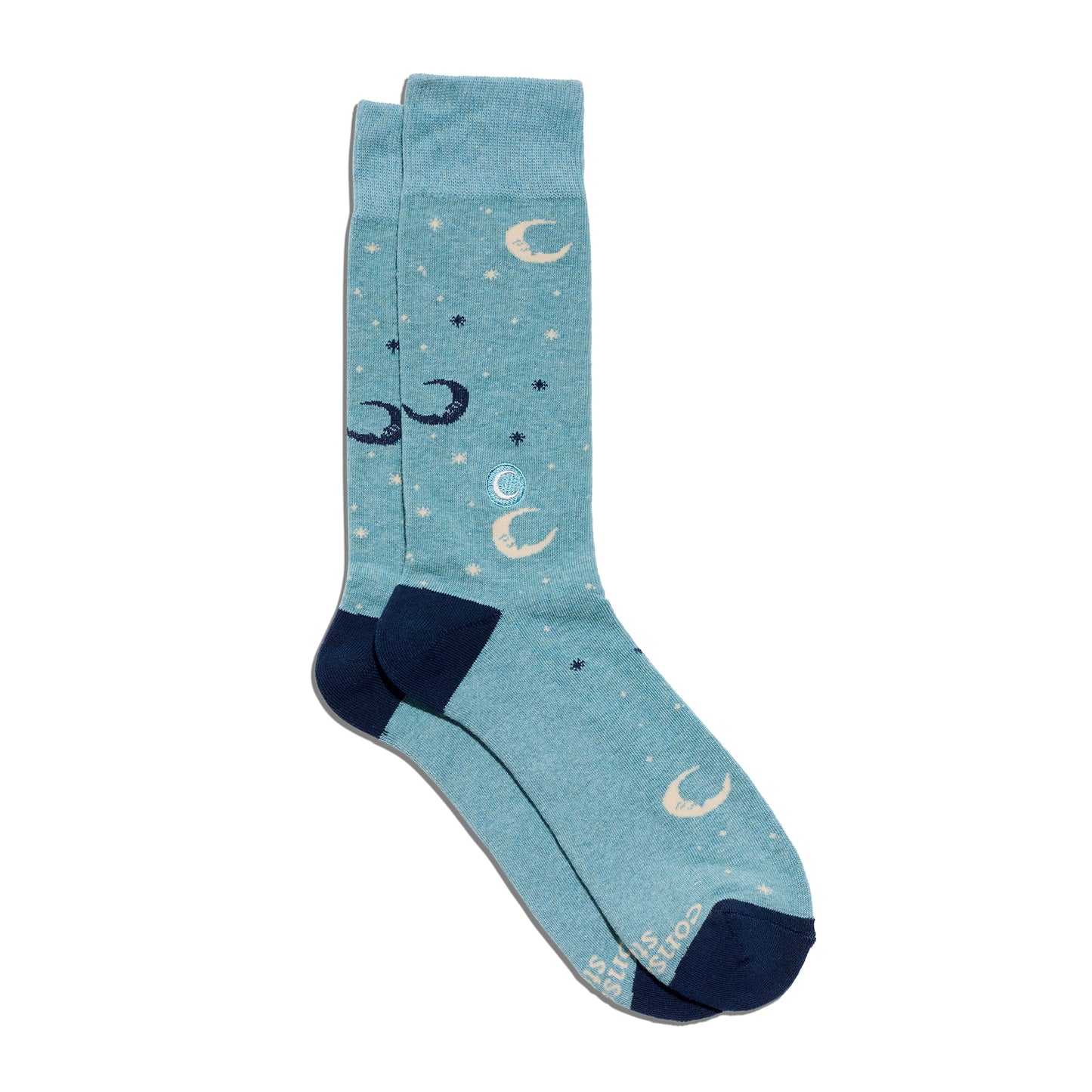 Blue socks with moon and star patterns on a white background