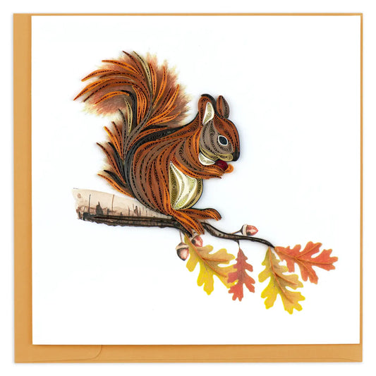 Quilled squirrel on a branch with autumn leaves against a white background